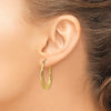 10k Polished Twisted Oval Hollow Hoop Earrings