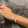 14k Tri-color Polished and Satin Diamond-cut Plumeria Hinged Oval Bangle Bracelet