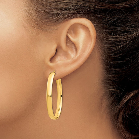 14k 5x44mm High Polished Oval Tube Hoop Earrings