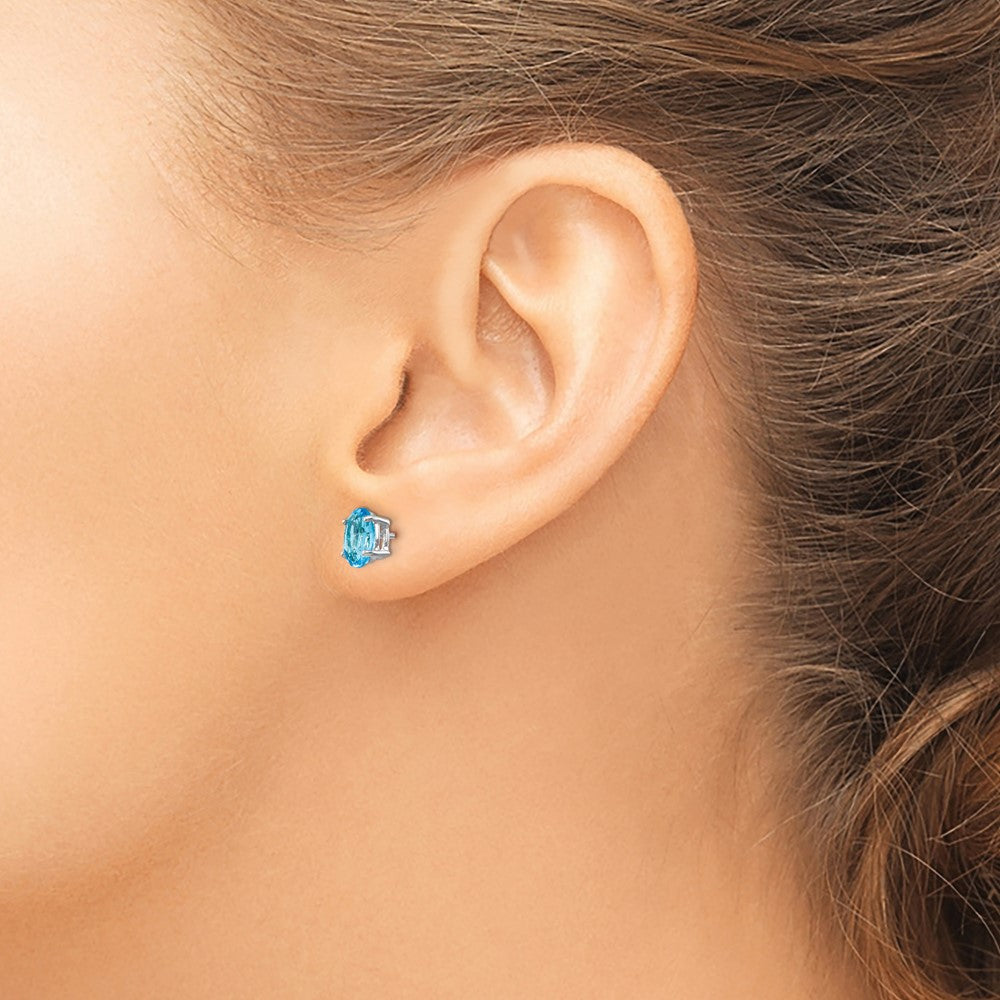 14k White Gold 7x5mm Oval Blue Topaz Post Earrings