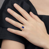 14k 7x5mm Emerald-cut Blue Sapphire and 1/20 carat AA Diamond Ring